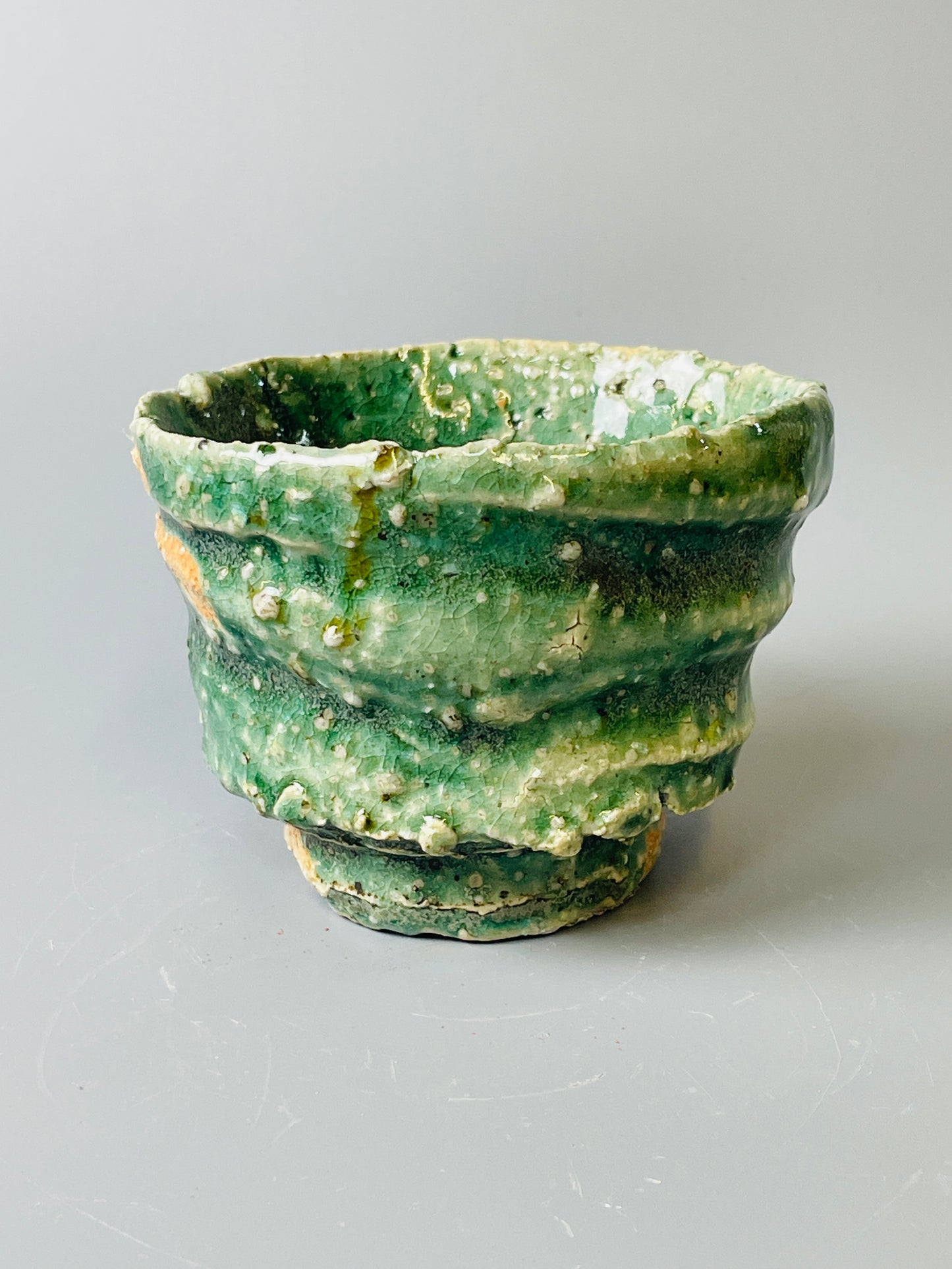 Shiga Oribe guinomi/espresso, side fired, inclusion body, needle ash, personal marks for AA, A147