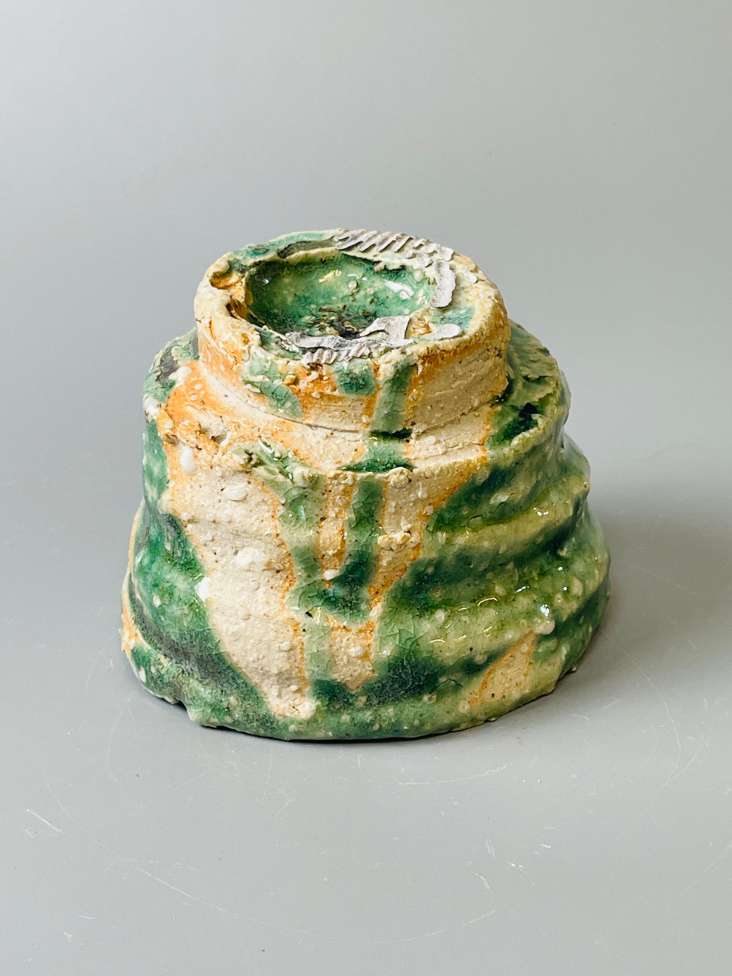 Shiga Oribe guinomi/espresso, side fired, inclusion body, needle ash, personal marks for AA, A147