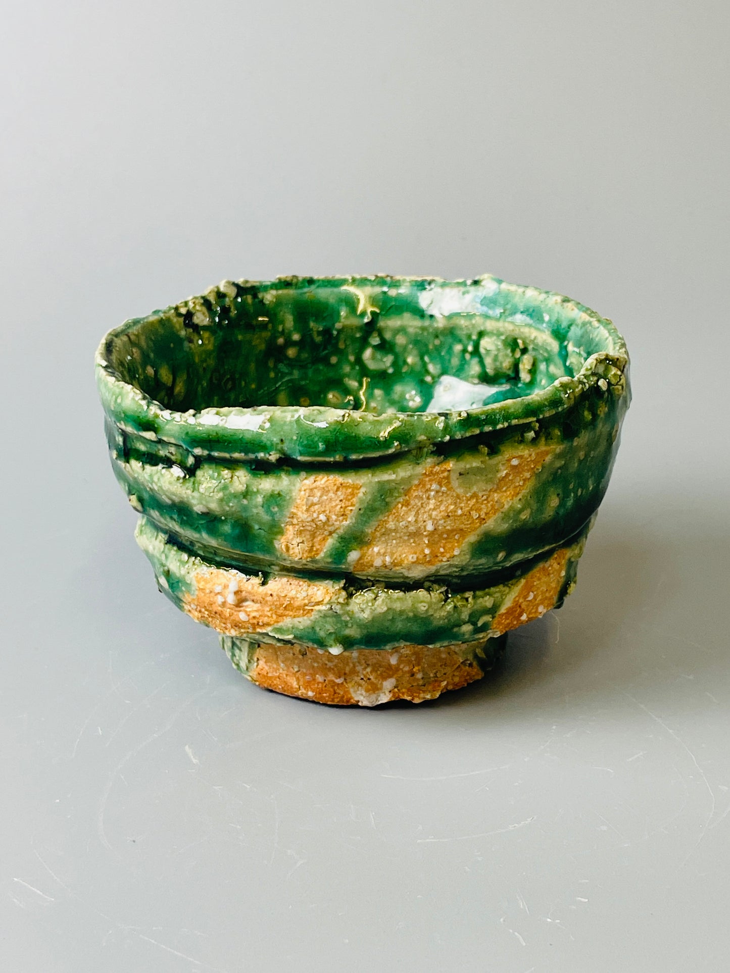 Shiga Oribe guinomi/espresso, side fired, inclusion body, needle ash, personal marks for AA, A140