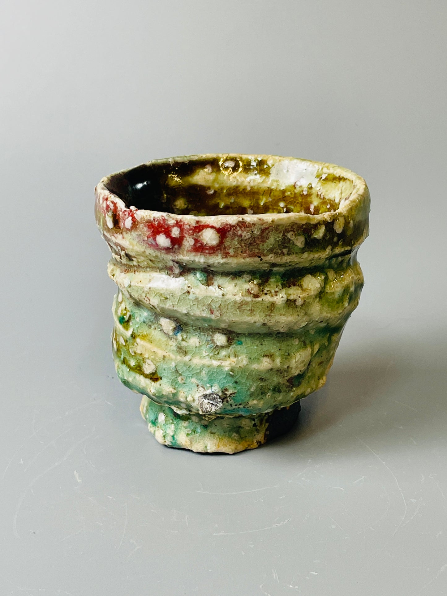 Shiga Oribe guinomi/espresso, side fired, inclusion body, needle ash, personal marks for AA, A141