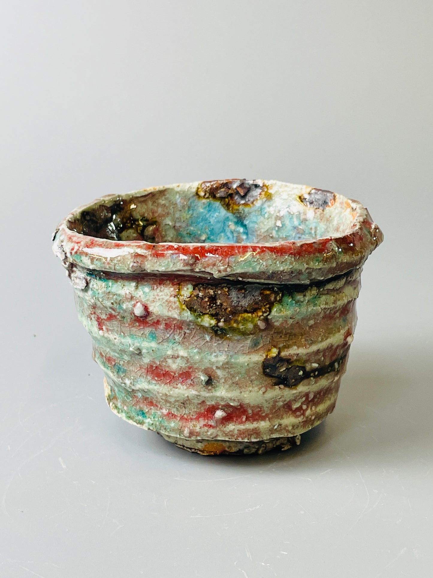 Shiga Oribe guinomi/espresso, side fired, inclusion body, needle ash, personal marks for AA, A143