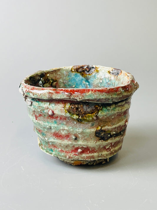 Shiga Oribe guinomi/espresso, side fired, inclusion body, needle ash, personal marks for AA, A143