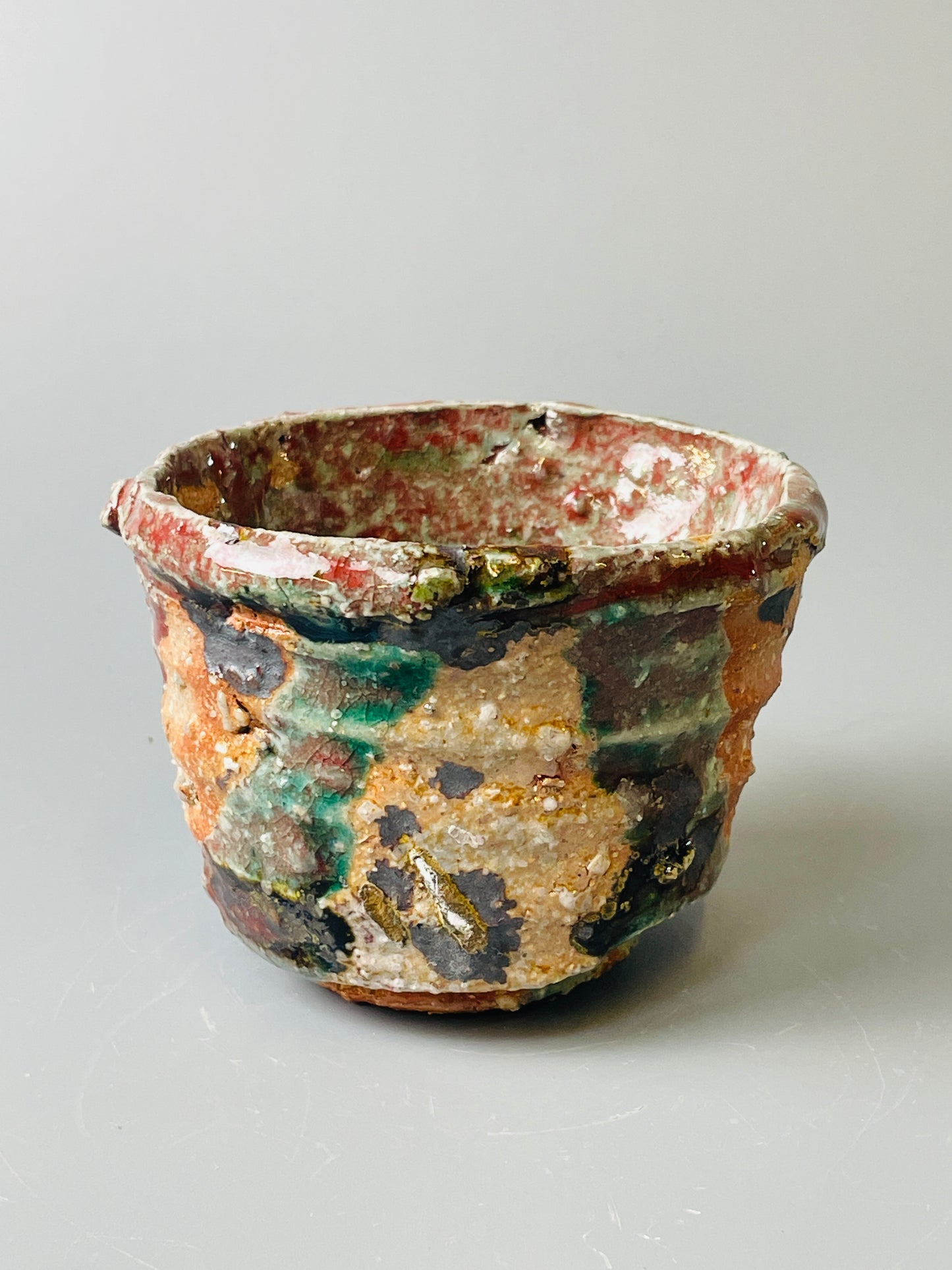 Shiga Oribe guinomi/espresso, side fired, inclusion body, needle ash, personal marks for AA, A143