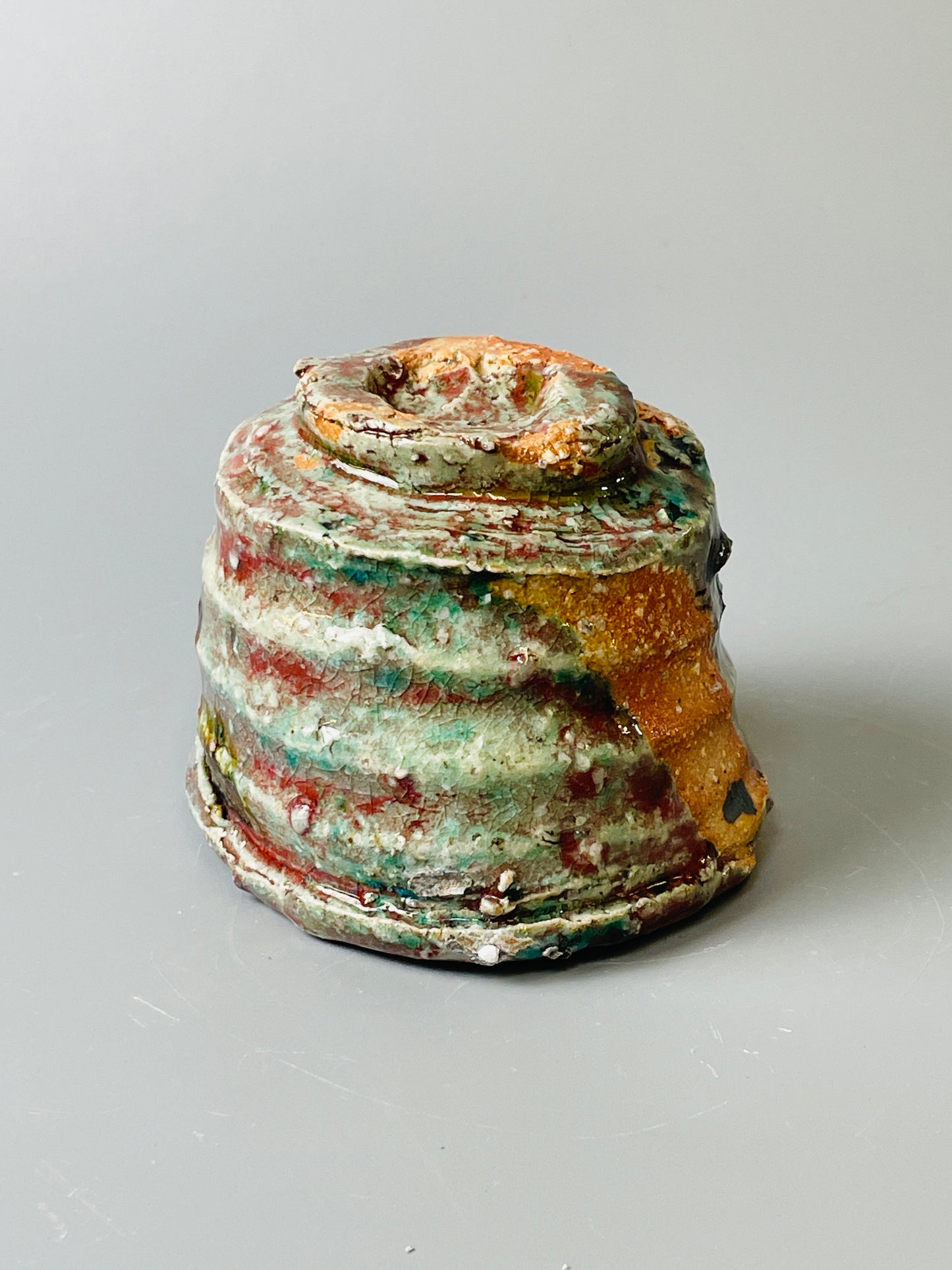 Shiga Oribe guinomi/espresso, side fired, inclusion body, needle ash, personal marks for AA, A143